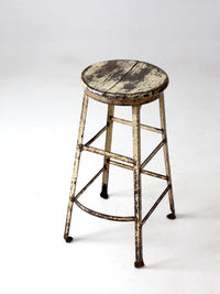 vintage industrial stool with wood seat