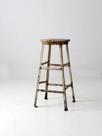 vintage industrial stool with wood seat
