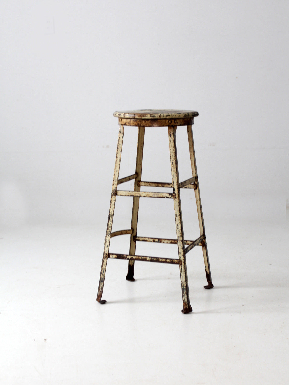 vintage industrial stool with wood seat