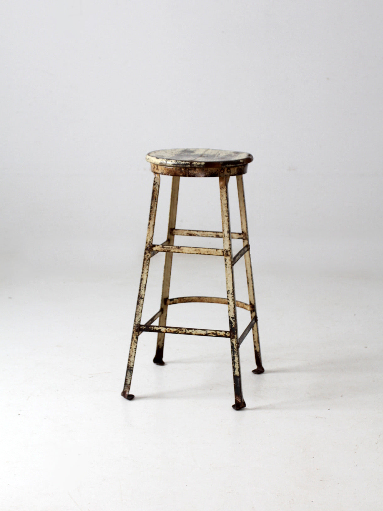 vintage industrial stool with wood seat