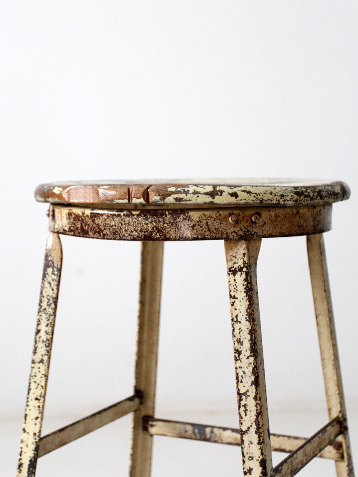 vintage industrial stool with wood seat