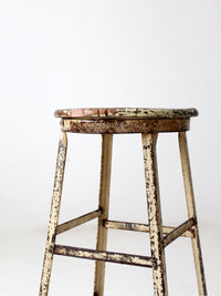 vintage industrial stool with wood seat