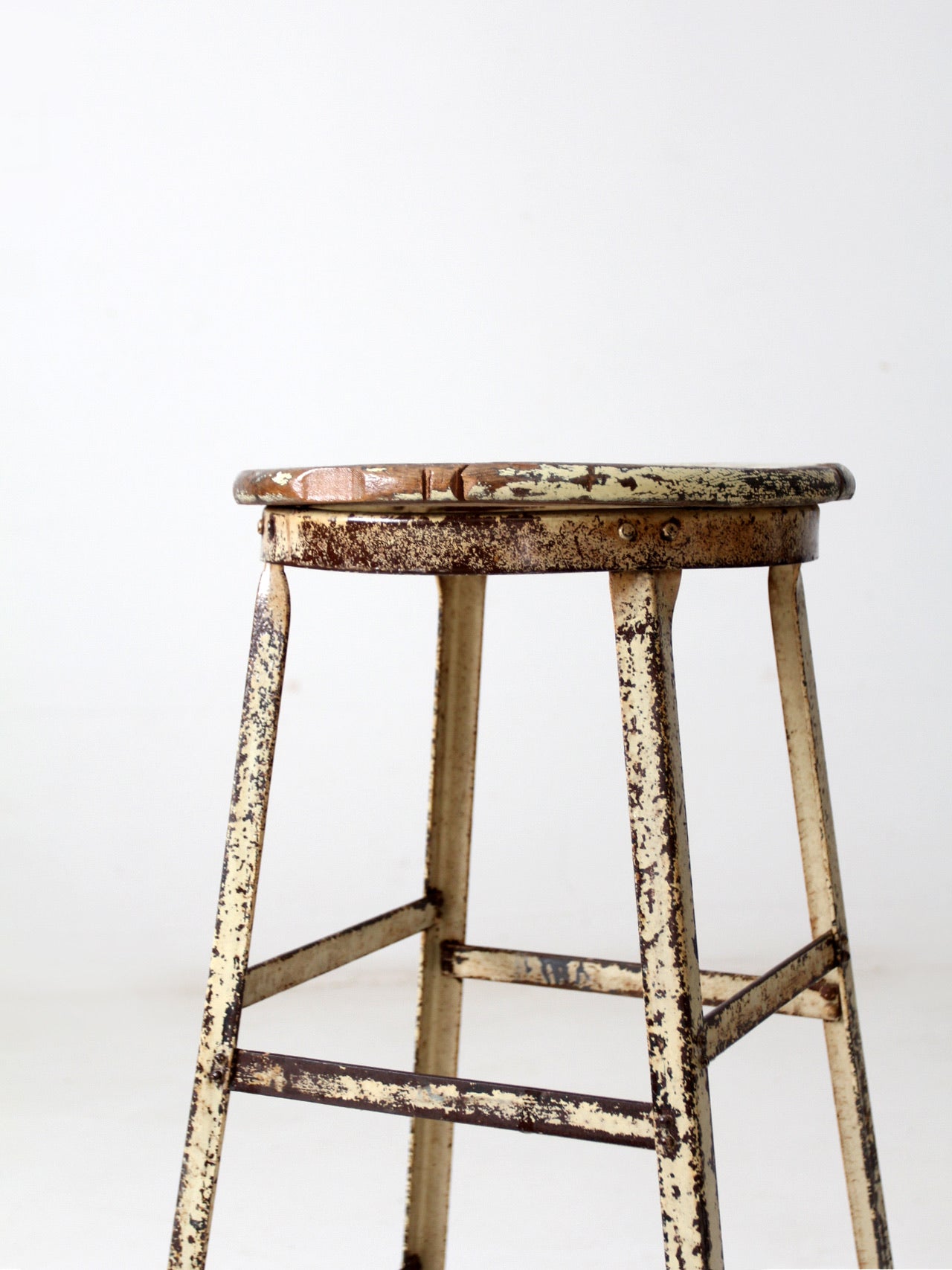 vintage industrial stool with wood seat