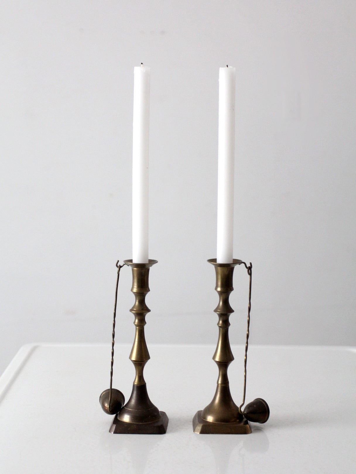 antique brass candlestick holders pair with hanging snuffers