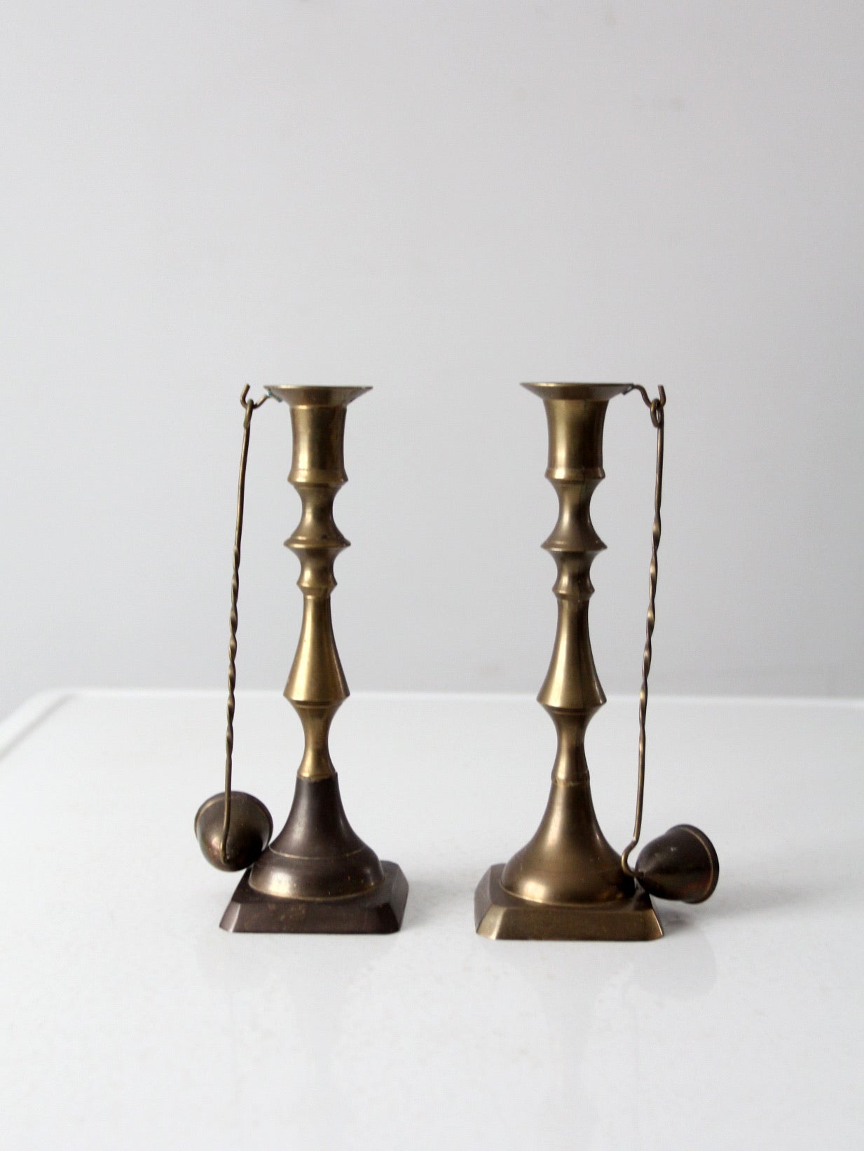 antique brass candlestick holders pair with hanging snuffers