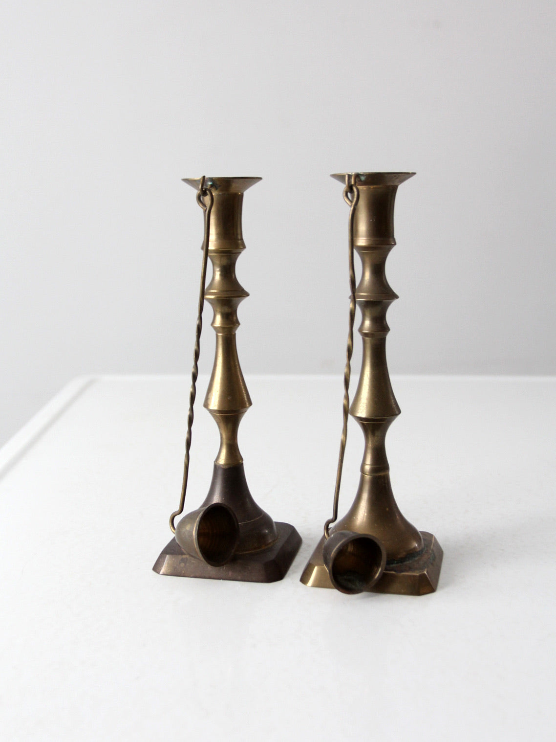 antique brass candlestick holders pair with hanging snuffers