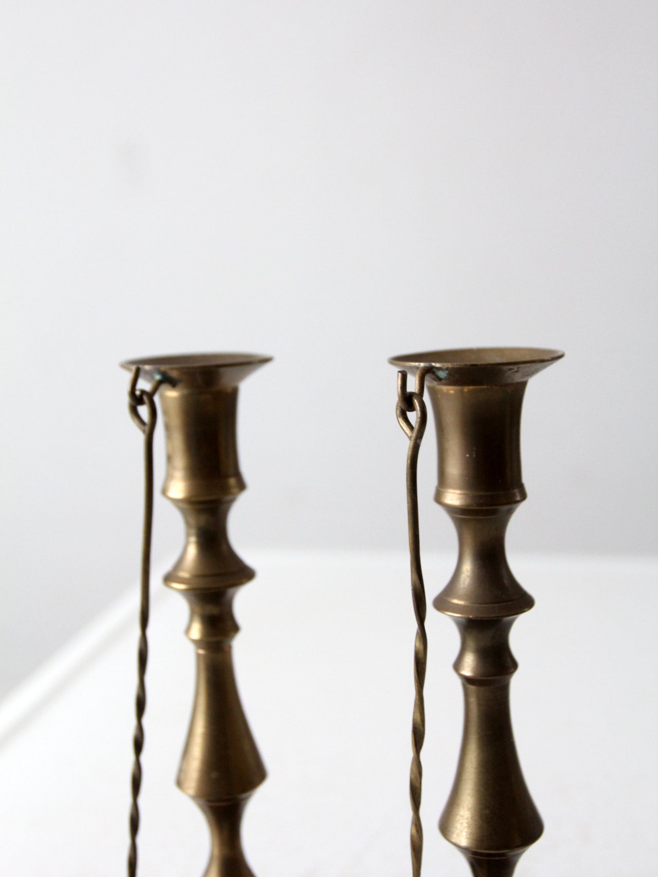 antique brass candlestick holders pair with hanging snuffers