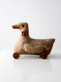antique toy duck on wheels