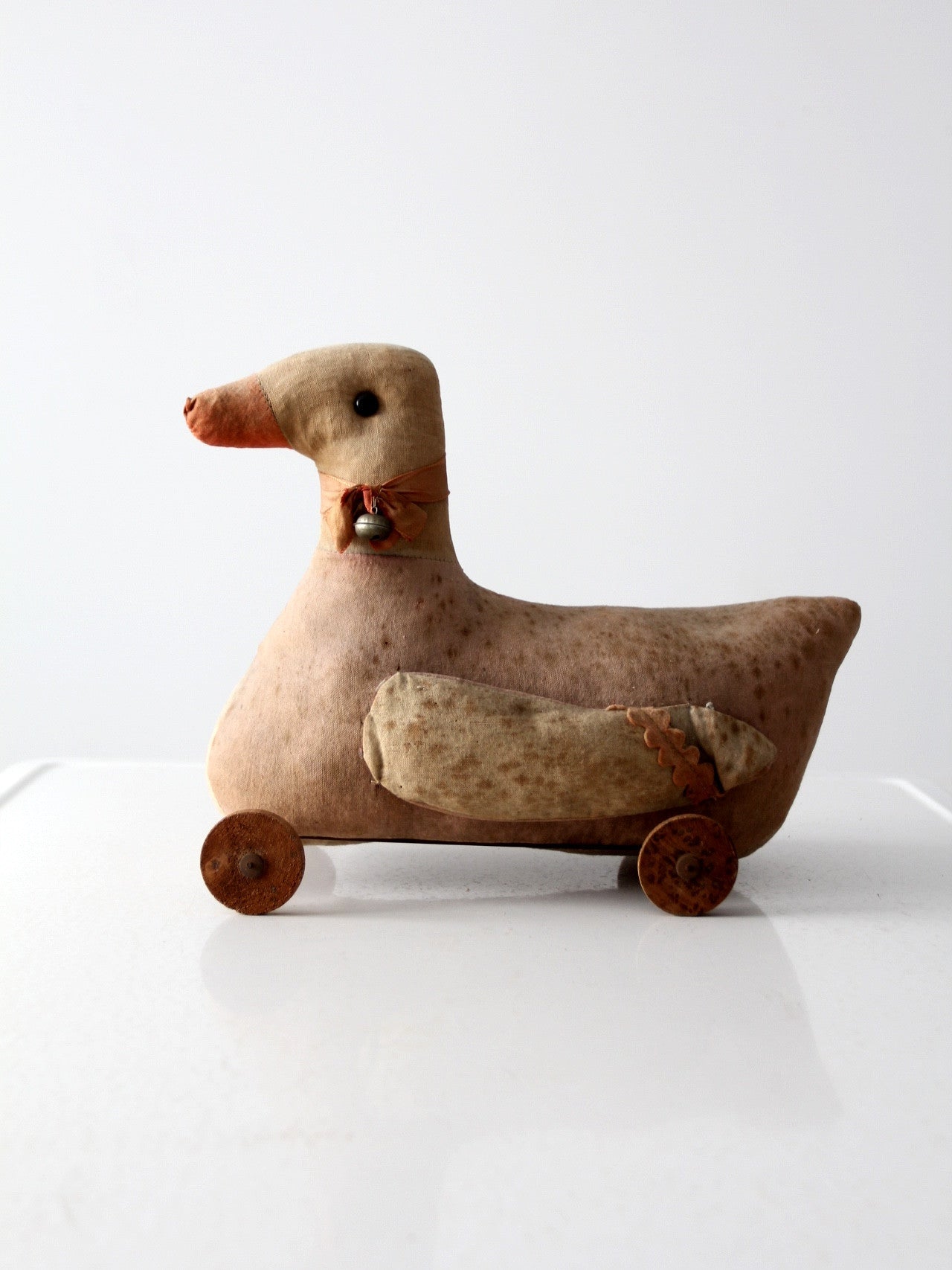antique toy duck on wheels