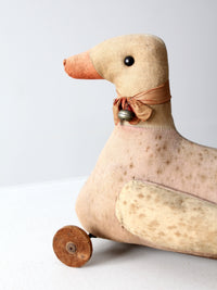 antique toy duck on wheels