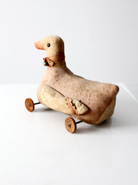 antique toy duck on wheels