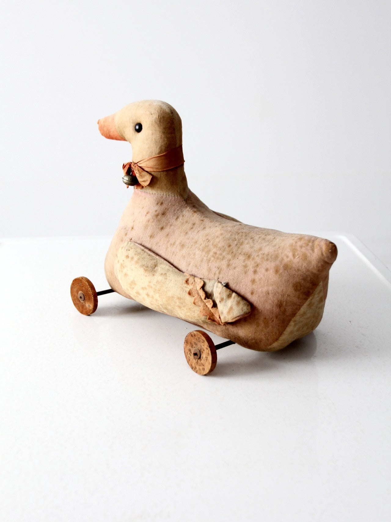 antique toy duck on wheels