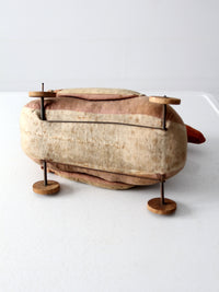 antique toy duck on wheels