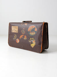 vintage leather suitcase with travel stickers