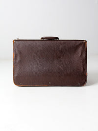 vintage leather suitcase with travel stickers