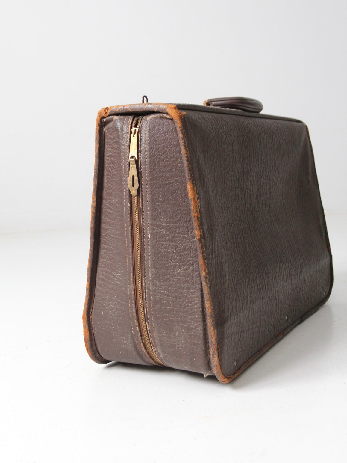 vintage leather suitcase with travel stickers