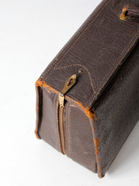 vintage leather suitcase with travel stickers