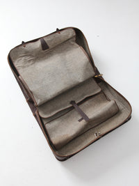 vintage leather suitcase with travel stickers