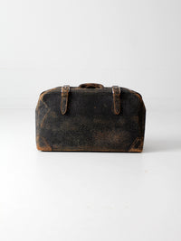 black leather suitcase circa 1930