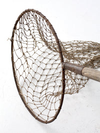 antique fish net on pole