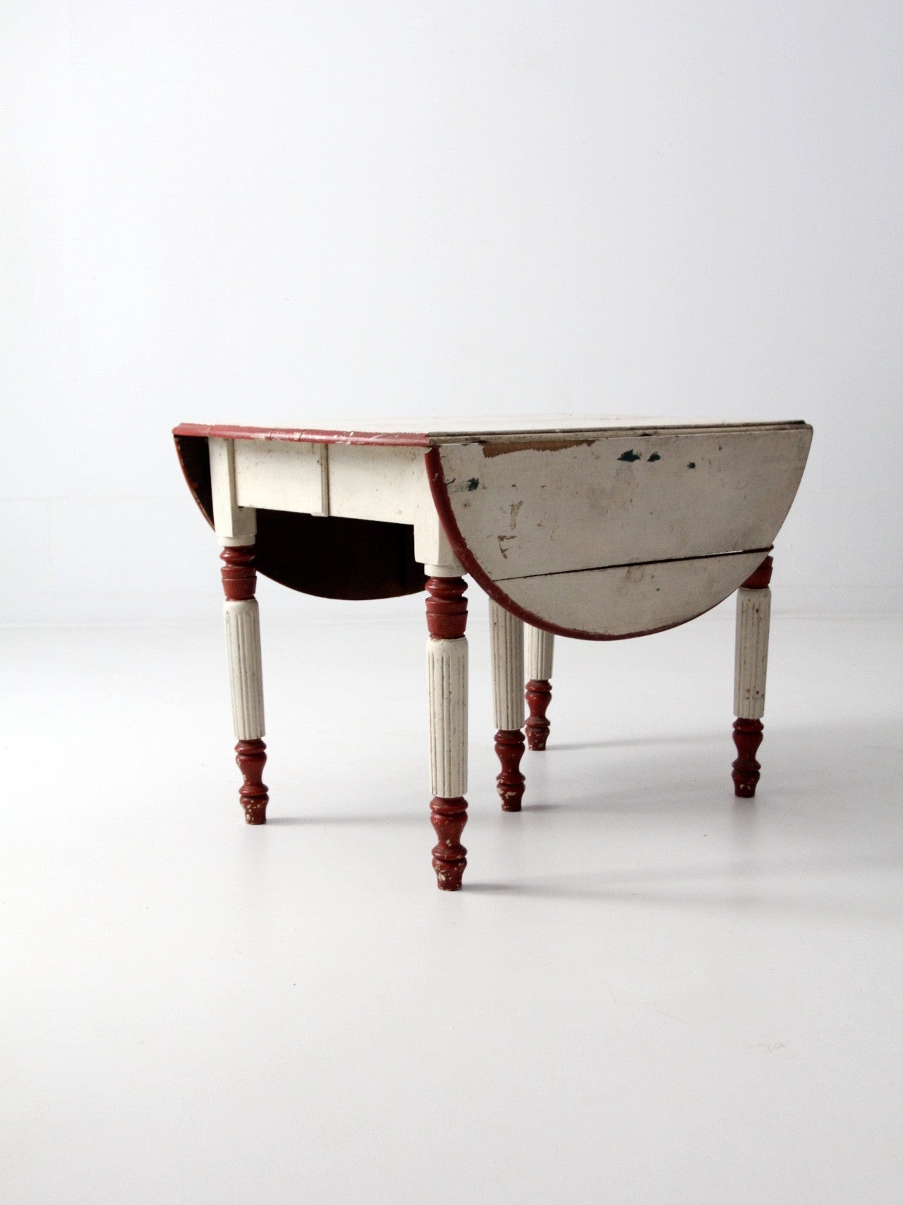 antique drop leaf five leg table