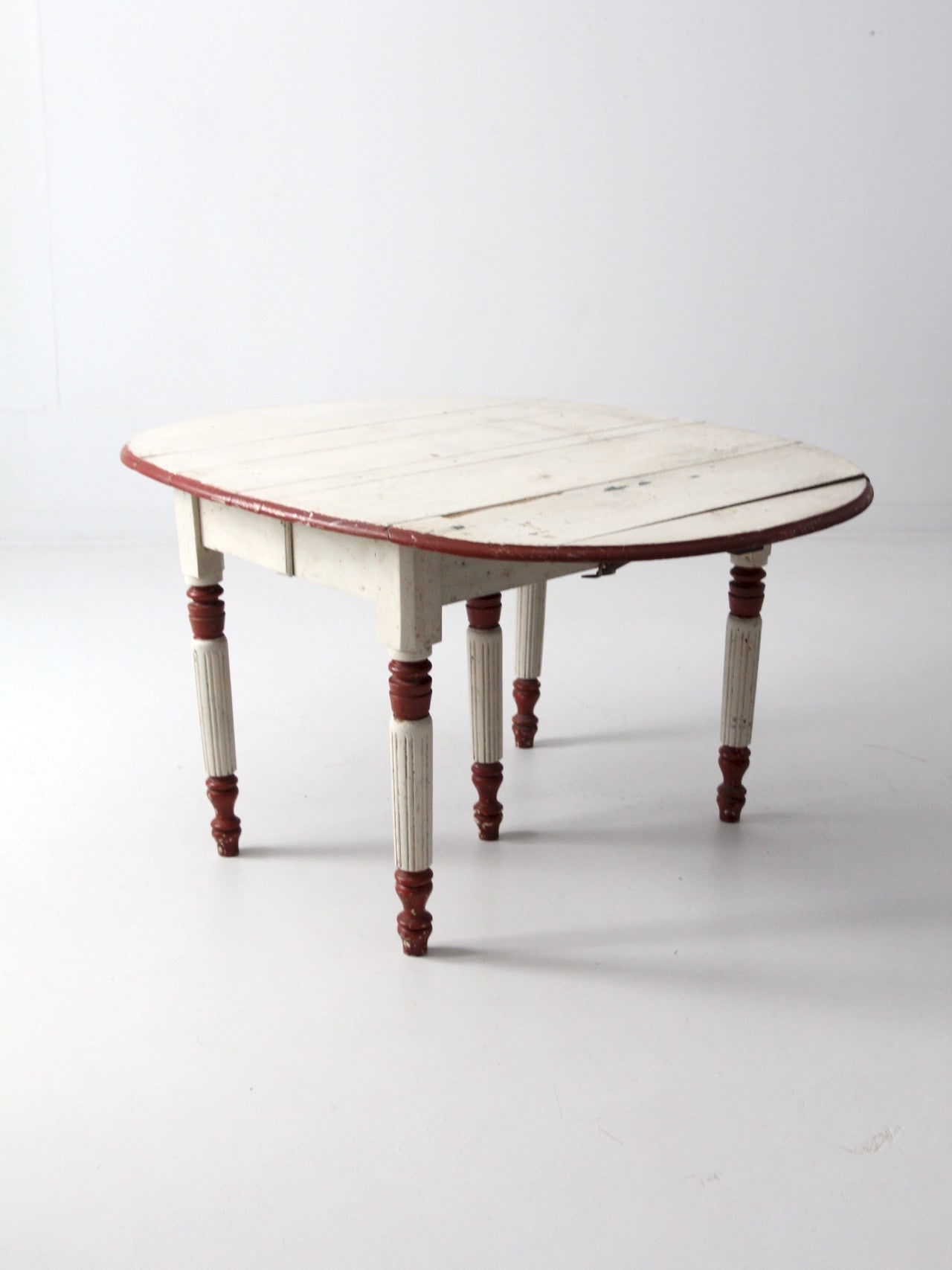 antique drop leaf five leg table