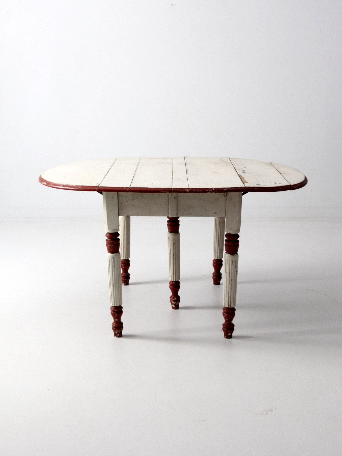 antique drop leaf five leg table