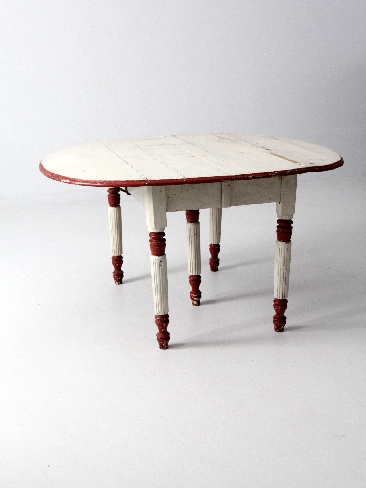 antique drop leaf five leg table