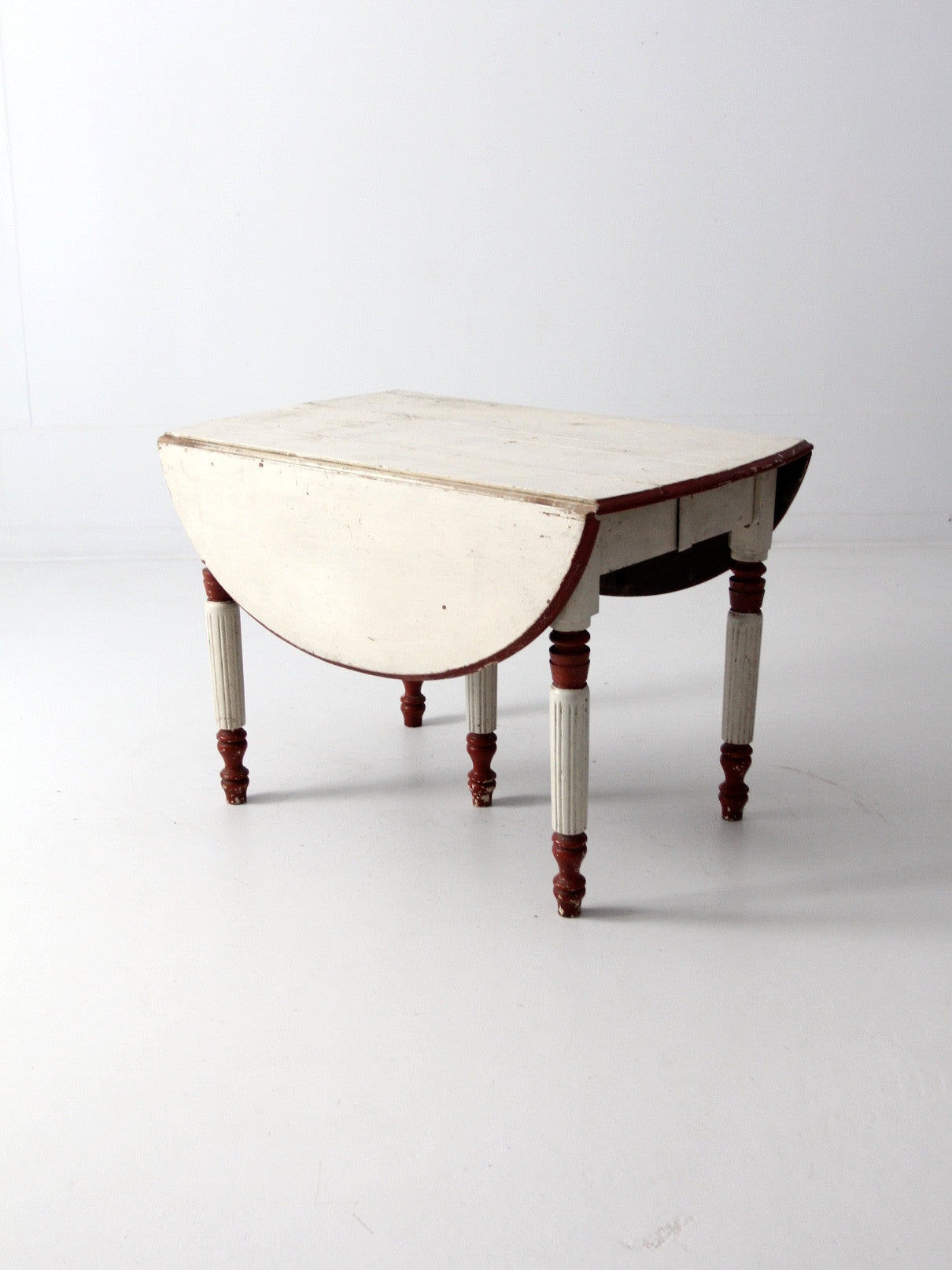 antique drop leaf five leg table