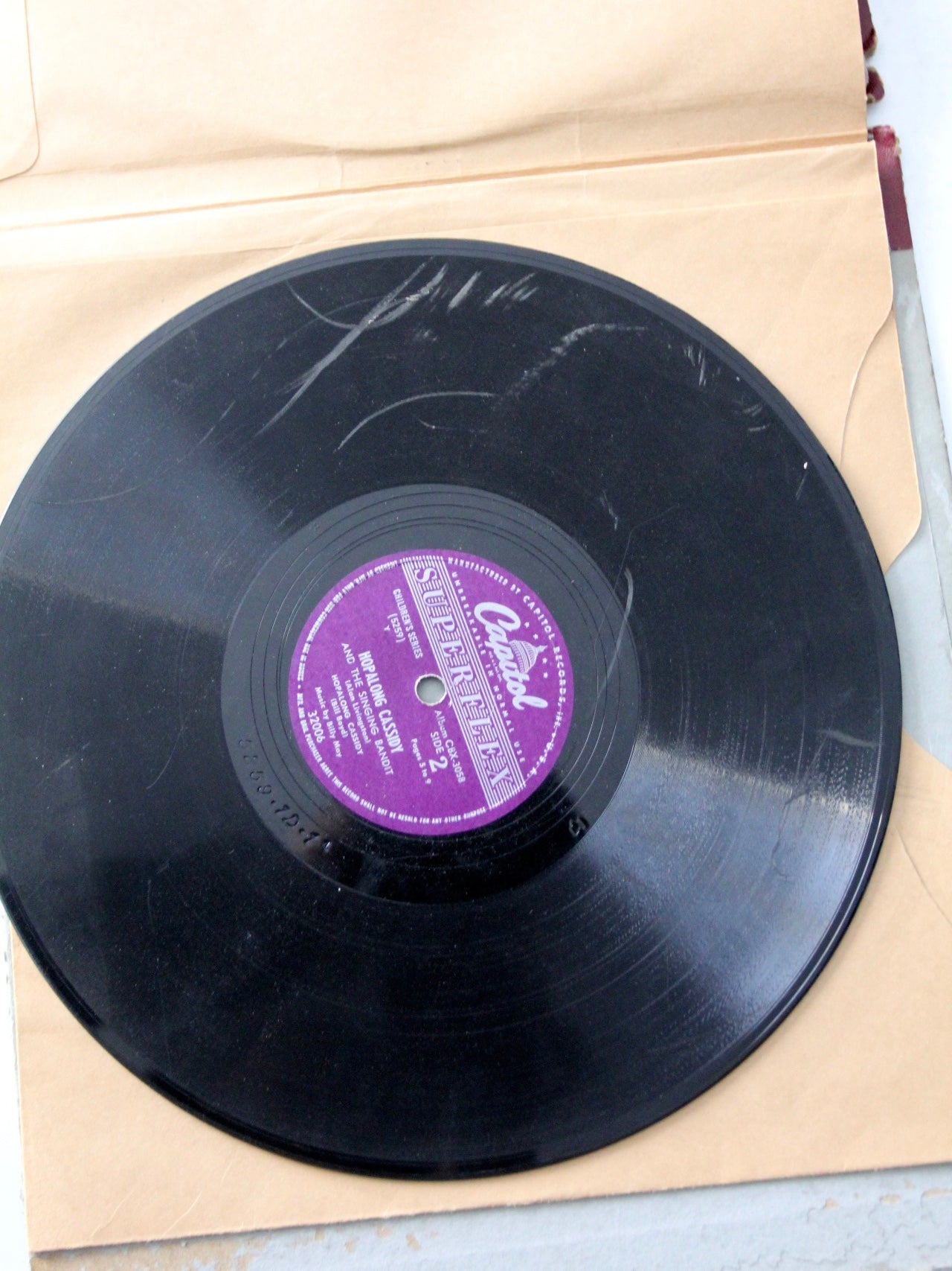 1950s Hoplalong Cassidy boots and record book