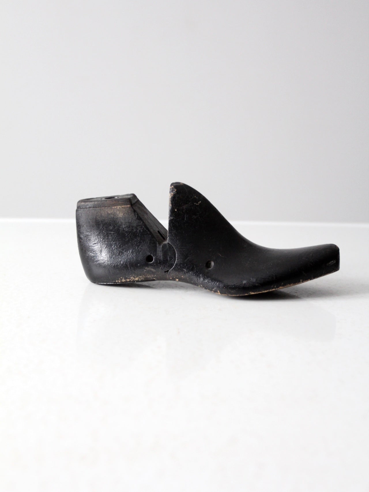 antique black wooden shoe form