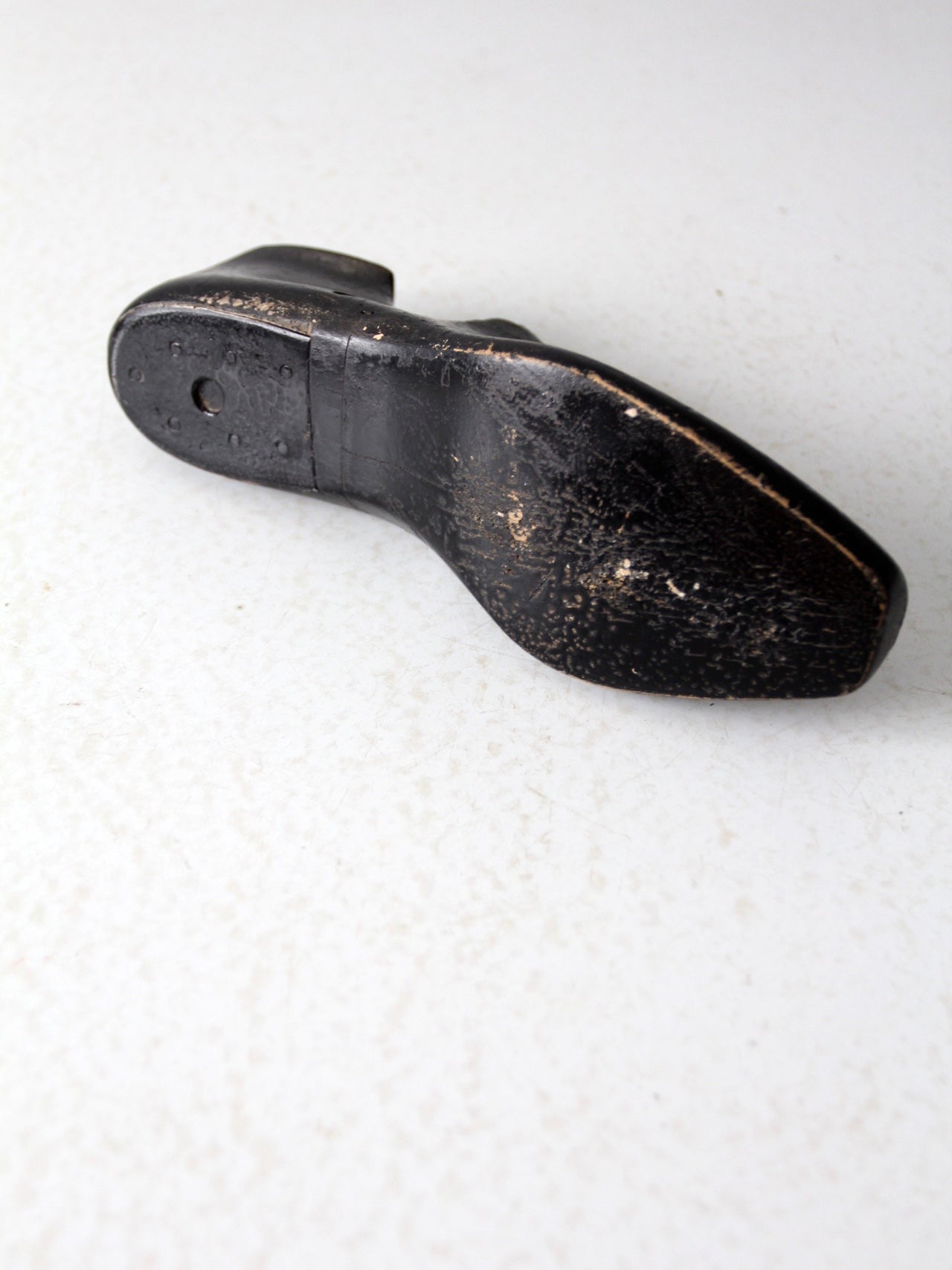antique black wooden shoe form