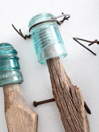 vintage glass insulators with wood posts, set of 4