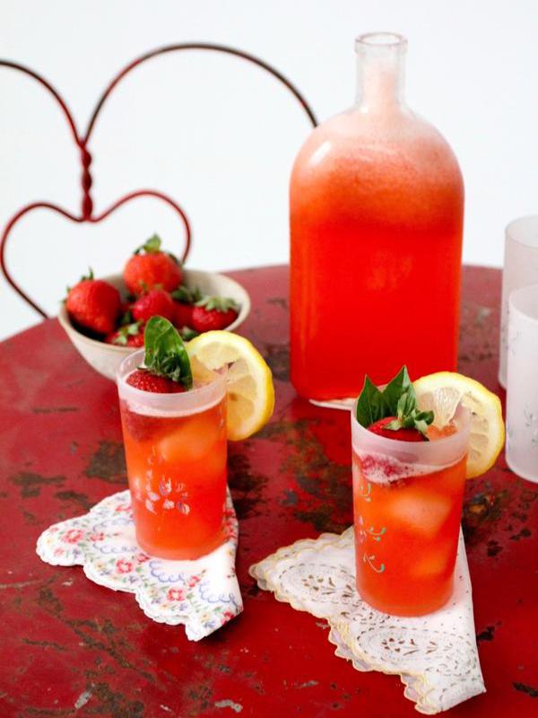 Strawberry Lemonade served in vintage glasses with a vintage Pyrex bottle as pitcher atop a red metal art nouveau "ice cream parlor" cafe table set. 