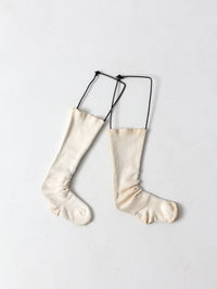 antique child size sock stretcher displays