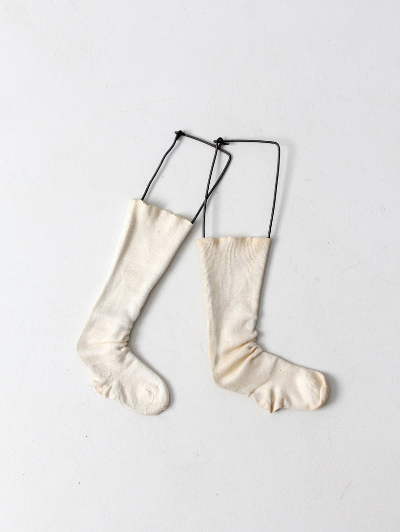 antique child size sock stretcher displays
