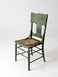 antique green pressed back chair with perforated seat