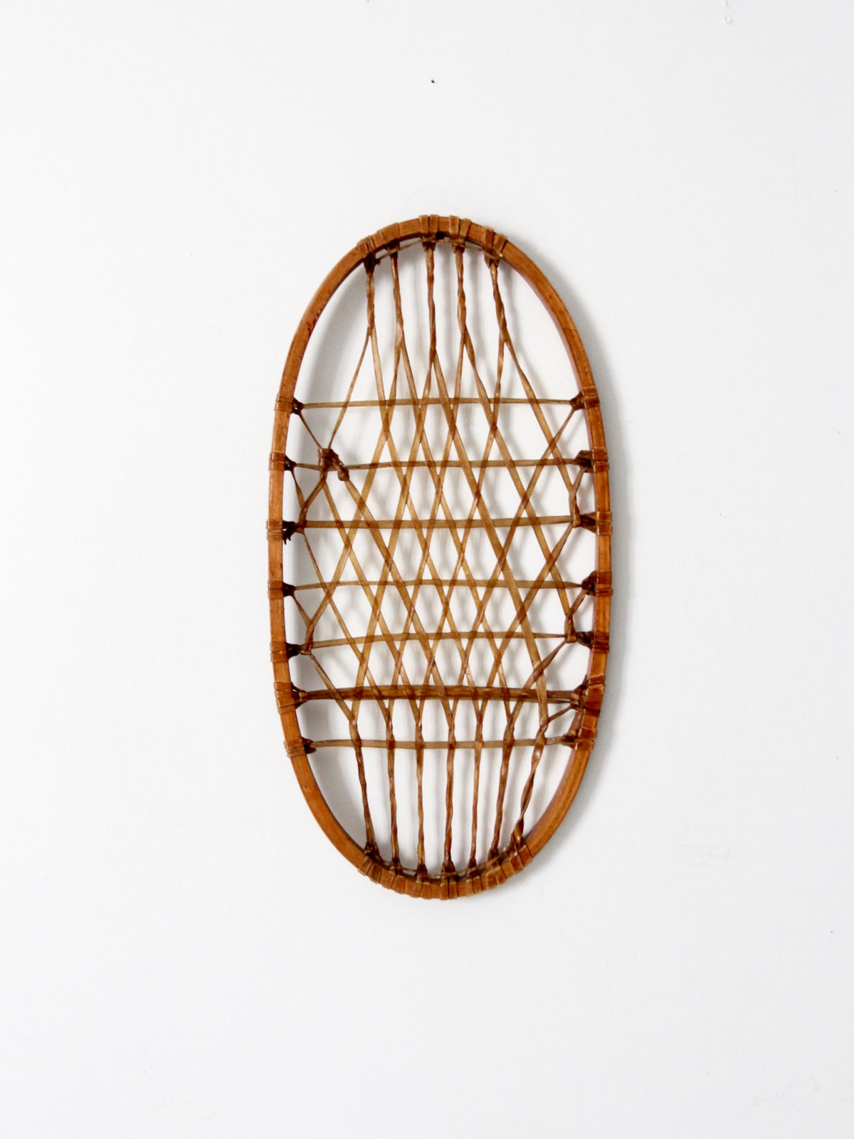 1940s Lund wooden snowshoe with rawhide webbing