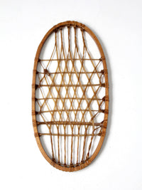 1940s Lund wooden snowshoe with rawhide webbing