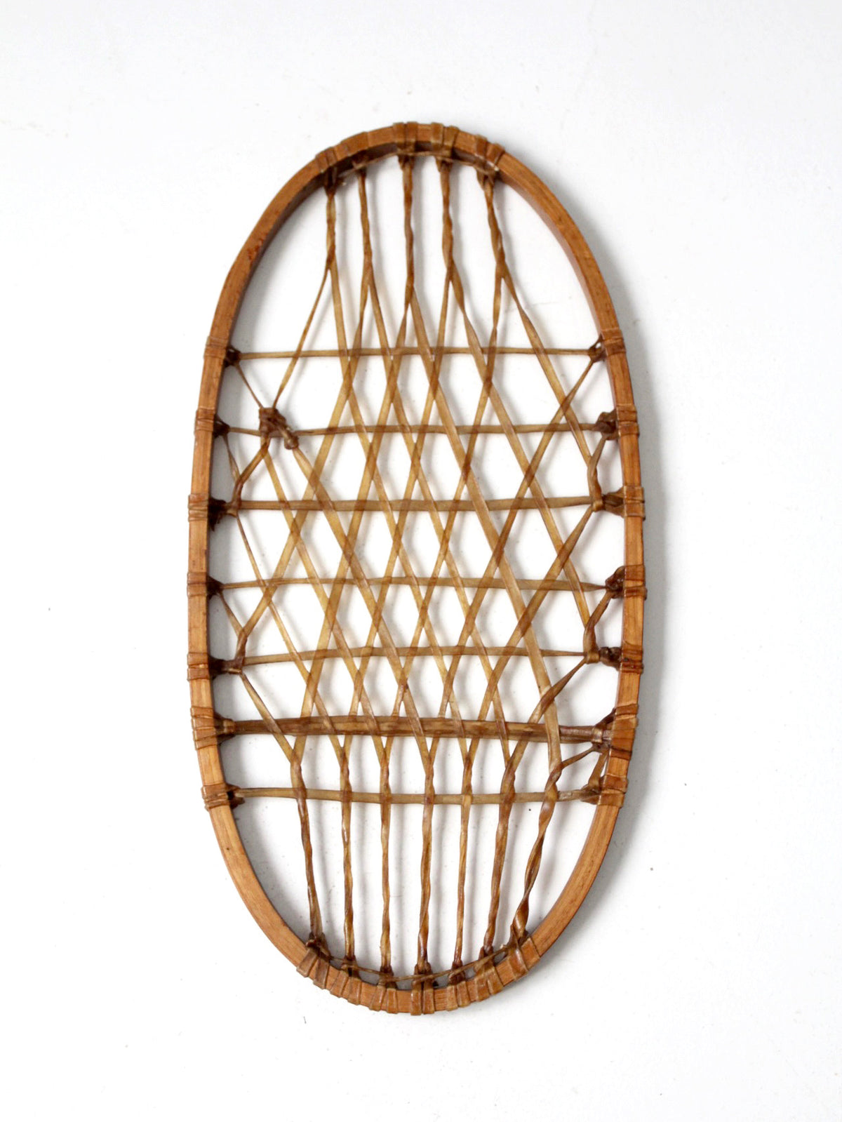 1940s Lund wooden snowshoe with rawhide webbing
