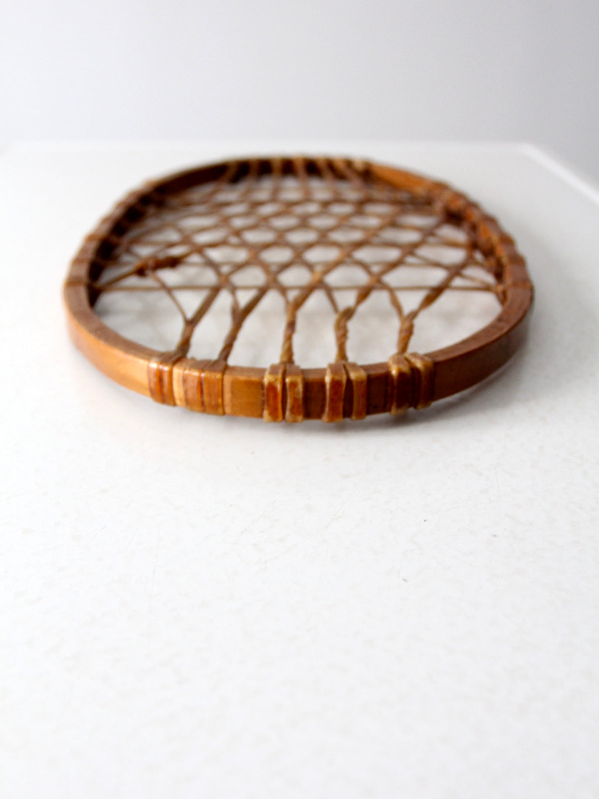 1940s Lund wooden snowshoe with rawhide webbing