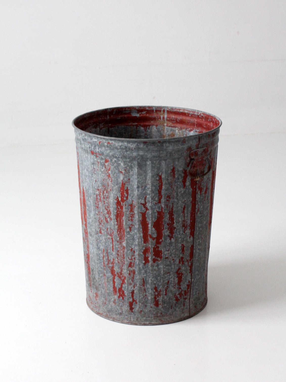 early 20th century red painted galvanized utility can