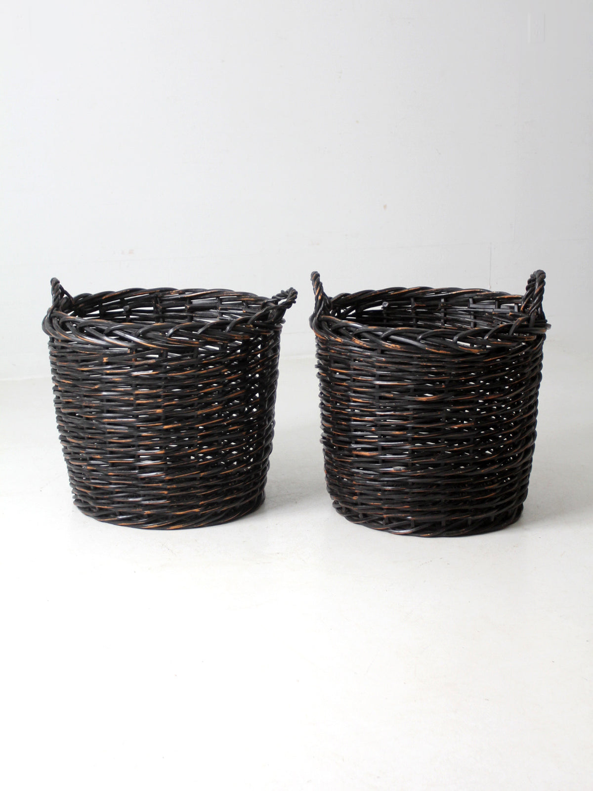 vintage black woven cane baskets pair