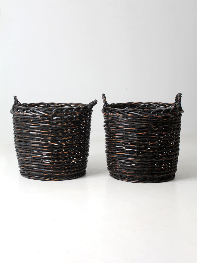 vintage black woven cane baskets pair