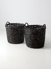 vintage black woven cane baskets pair