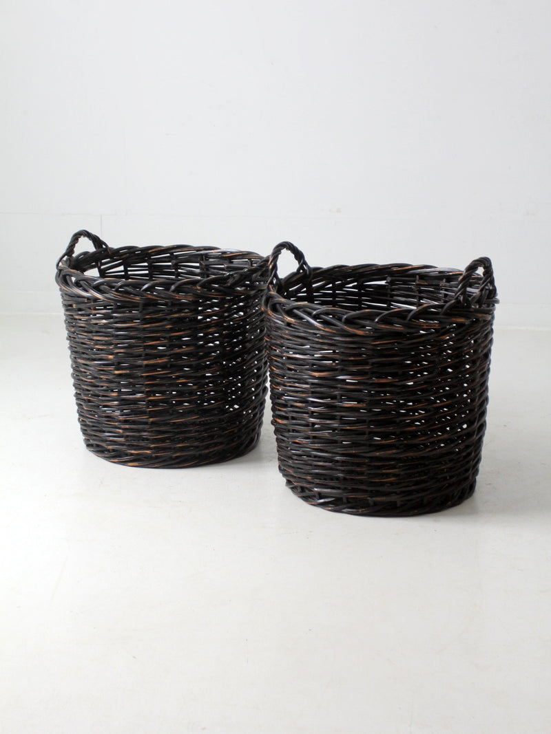 vintage black woven cane baskets pair