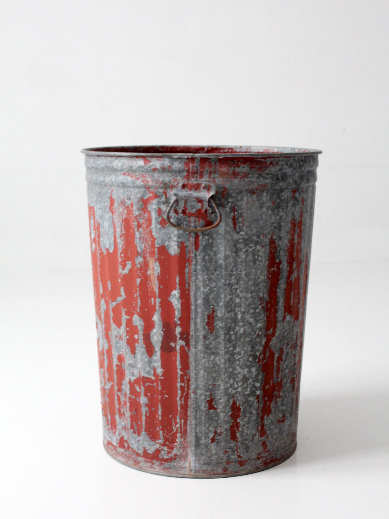 early 20th century red painted galvanized utility can