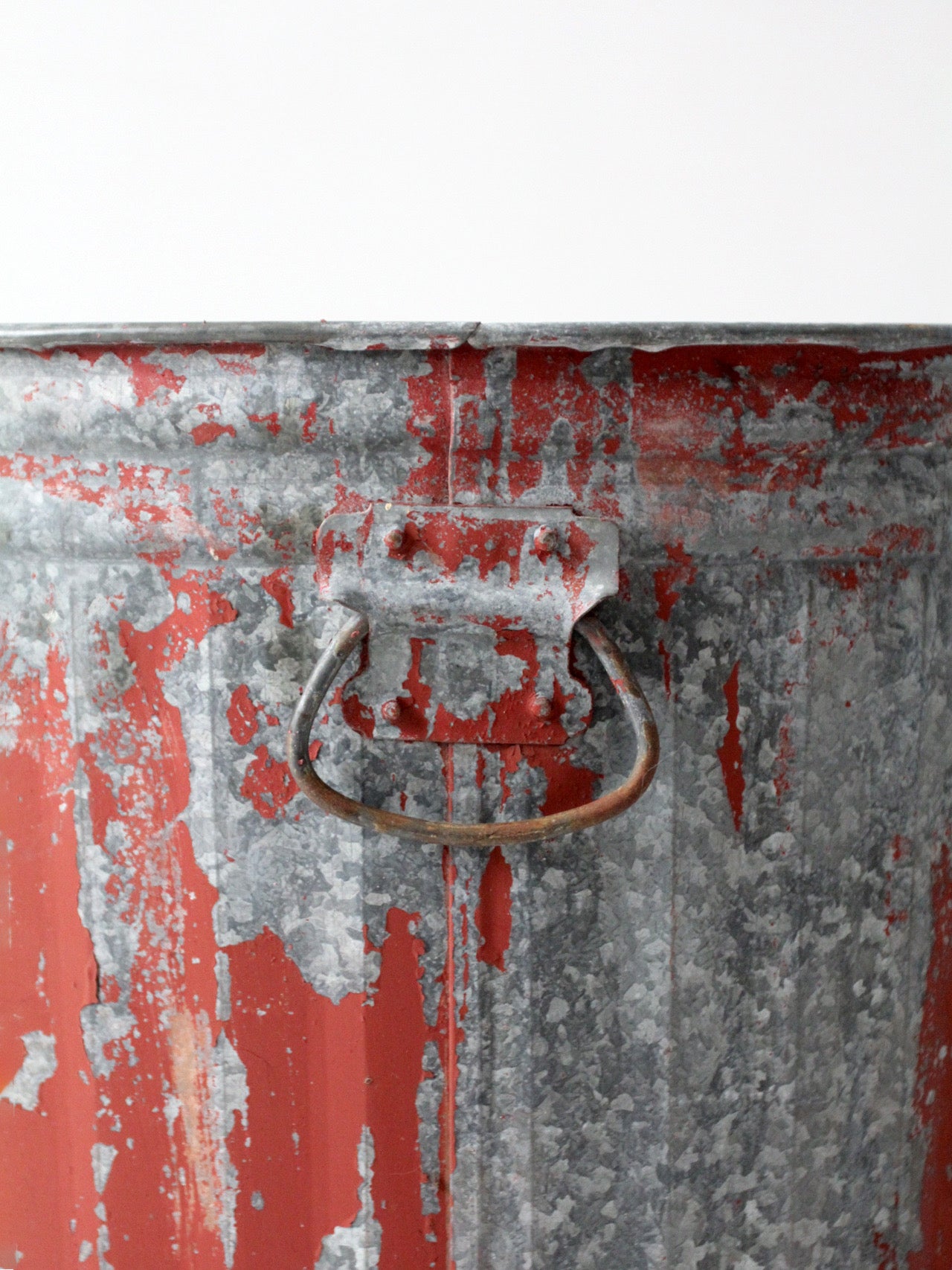 early 20th century red painted galvanized utility can