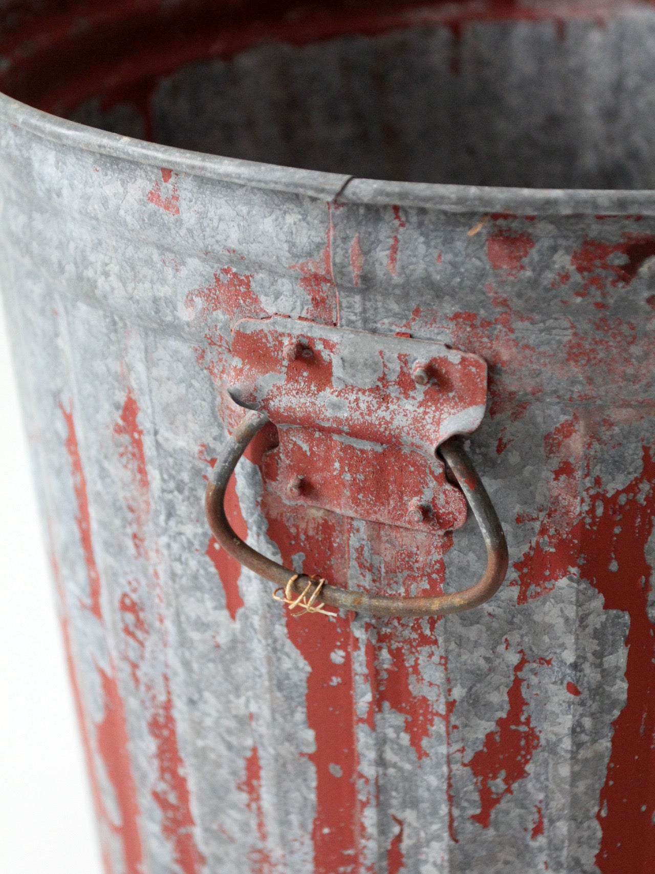early 20th century red painted galvanized utility can