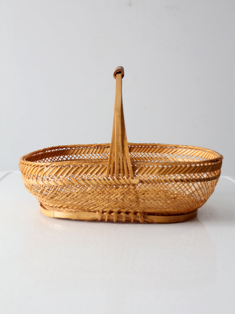 vintage 1970s rattan basket with handle